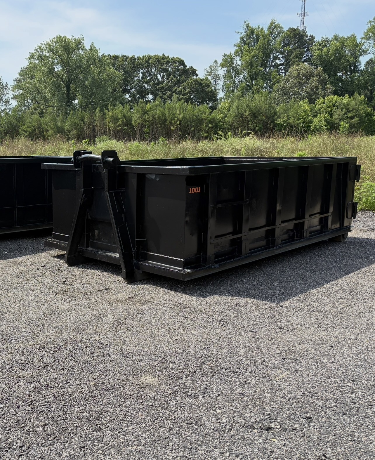 RISE Dumpsters 10-yard roll-off dumpster rental on a Chesapeake, VA driveway with wood board driveway protection.
